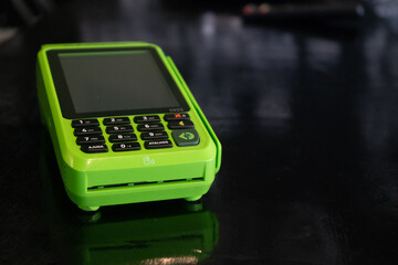 green card machine on the black table