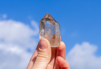 Natural rock crystal mineral in hand