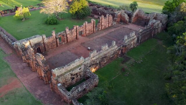 Circling view of the side and front of the church at the San Ignacio Jesuit mission ruins in Northern Argentina Aerial video