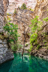 Turquoise mountain lake among the rocks.