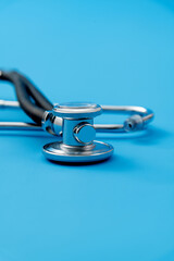Close up of stethoscope on blue background