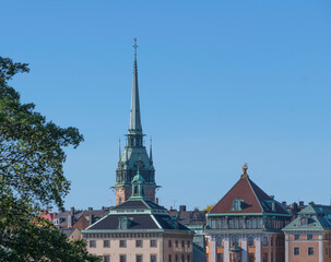 The gothic church tower of the church Tyska Kyrkan in the old town Gamla Stan a sunny autumn day in Stockholm