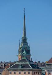 The gothic church tower of the church Tyska Kyrkan in the old town Gamla Stan a sunny autumn day in Stockholm