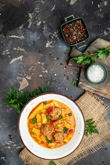 stew vegetables with meatballs on a dark background, Delicious balanced food concept, place for text, top view