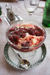 Hot red fruits with vanila ice cream on cup