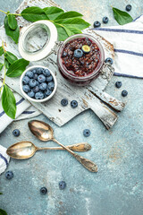 blueberry jam in a jar. Homemade food concept. vertical image. top view. place for text