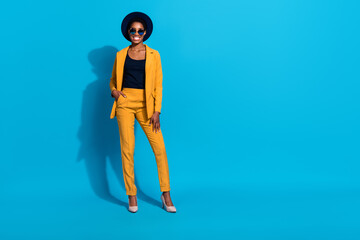 Full size portrait of charming confident person arm pocket wear stilettos isolated on blue color background