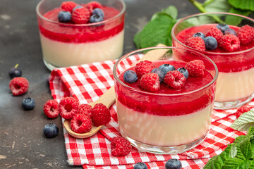 Raspberry sorbet with whipped cream and mint. Italian dessert on a light background in small jars. Long banner format. place for text