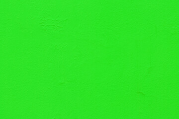 Abstract background of green plaster on the wall.