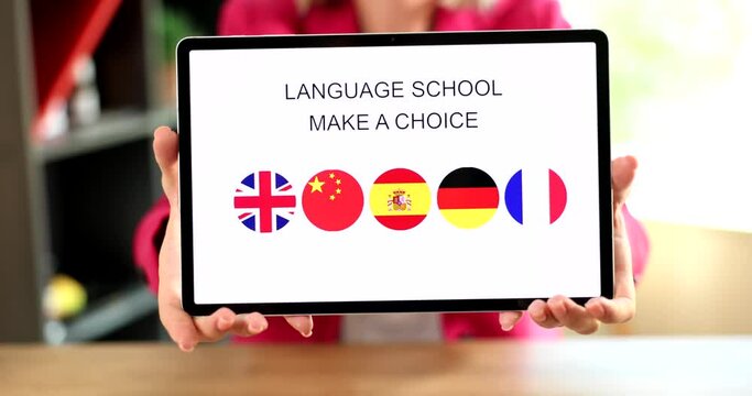Online learning foreign language on tablet closeup
