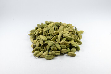 Green cardamom or cardamon or cardamum or green elaichi isolated on white background. Top view. Close up