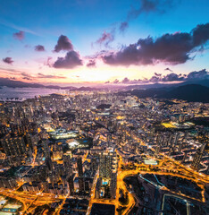 Fototapeta premium Futuristic cityscape, cyberpunk tone of metropolis, Kowloon, Hong Kong, Night aerial view
