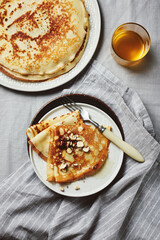 Crepes with honey and hazelnuts.