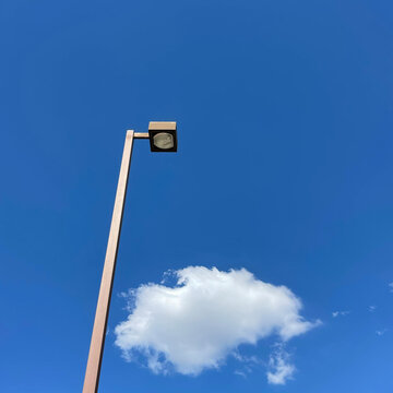 lamp post against blue sky