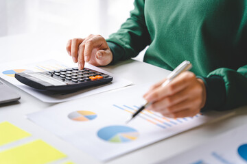 Portrait of a woman working on a tablet computer in a modern office. Make an account analysis report. real estate investment information financial and tax system concepts