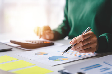 Portrait of a woman working on a tablet computer in a modern office. Make an account analysis report. real estate investment information financial and tax system concepts