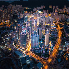 Naklejka premium Futuristic cityscape, cyberpunk tone of metropolis, Kowloon, Hong Kong, Night aerial view