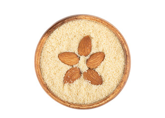 Almond grains on almond flour in a wooden bowl over white background.