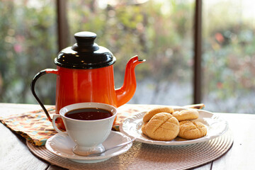 traditional brazilian coffee with homemade cookies crackers and teapot