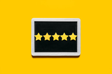 Customer Experience, Review Concept. Five yellow stars excellent rating in frame on yellow...