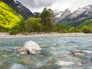View of a stream in front of the Pineta cirque, in the Ordesa National Park, Pyrenees mountains (Spain).