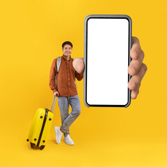 Tourist Man Showing Phone With Huge Blank Screen, Yellow Background