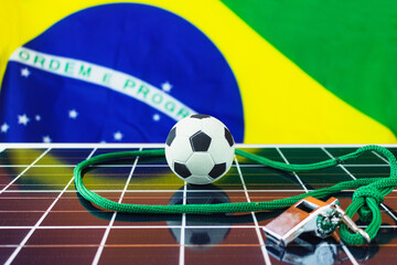 Soccer Ball and Brazil Flag over Photovoltaic Solar Panel. World Cup and Technology Concept Image for Design.