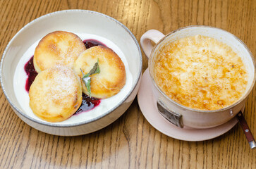 cheesecakes with jam and a cup of coffee