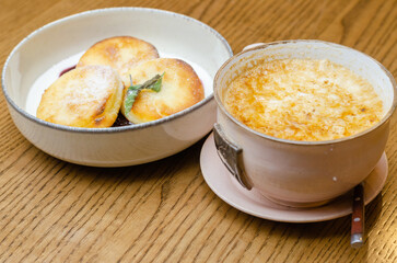 cheesecakes with jam and a cup of coffee