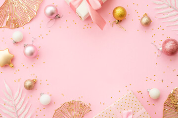 Christmas decorations at pink background. White and golden christmas decorations top view with space for design.