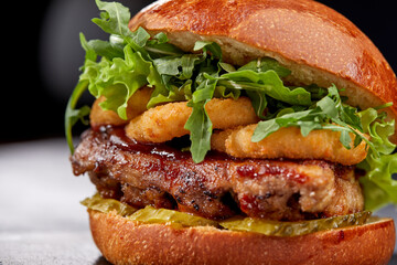 tasty burger with beef cutlet and vegetables