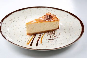 tasty cheesecake with chocolate sauce