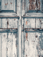 Texture of old shabby blue wooden door