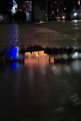 obelisk reflection on sidewalk water pond at sunset Buenos Aires, Argentina