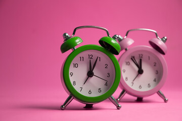 Alarm clock on a colored background