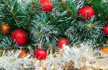 Christmas red decoration close-up on spruce branches. Christmas and New Year holidays background.