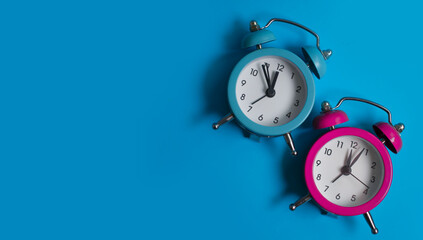 Alarm clock on a colored background