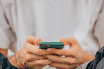 closeup of hands with mobile phone or smartphone