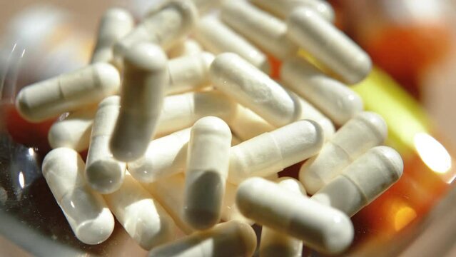 Tablets, capsules, antibiotics. Disease prevention. Treatment for colds and flu. Coronavirus. Receptor drugs. White and green pills.