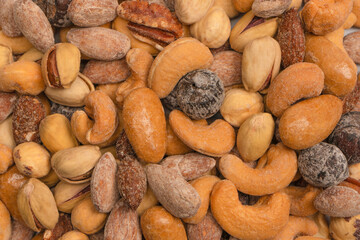  A group of almonds, pistachios, walnuts, macadamia, cashews.