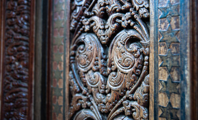 Wood carving on a doorstep pile in Kandy