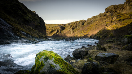 A river flowing through some canyon in the Iceland