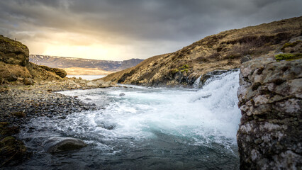 Sunset above mountains in Iceland with river