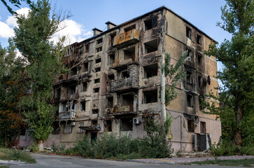 destroyed and burned houses in the city during the war in Ukraine