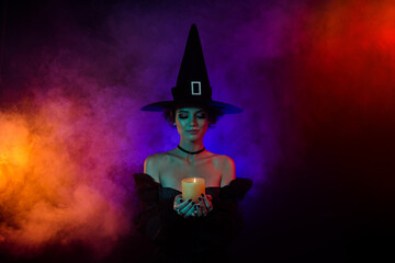 Photo of lady sorceress doing fear frightening occult spell hold candle fire flame isolated on...