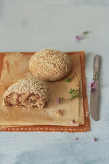 Obraz na płótnie Canvas Wholemeal flour rolls / wheat bread with sesame, homemade pastries for breakfast, healthy meal, healthy diet concept, culinary magazine, food book.
