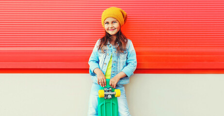 Portrait of little girl child with skateboard on city street © rohappy