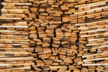 stack of firewood in countryside as a textured background