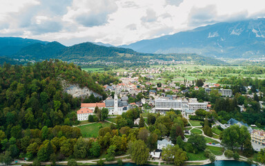 Fototapeta na wymiar The iconic city of Slovenia, Bled with its island and church as well as the bled castle. Beautiful Panoramic view