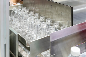 many clear plastic pet empty bottle after manufacturing process for fill water or beverage in production line